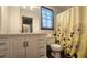 Bathroom featuring a vanity with a granite top, a mirror, and a shower with a floral curtain at 1200 Izod Ct, Lawrenceville, GA 30044