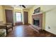 Spacious room features a brick fireplace, natural lighting and two storage closets at 1200 Izod Ct, Lawrenceville, GA 30044