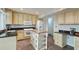 Traditional kitchen with granite countertops, custom cabinetry, and a center island for prep space at 1200 Izod Ct, Lawrenceville, GA 30044