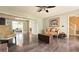 Bright living room featuring hardwood floors, neutral walls, and a classic sofa with a decorative armchair at 1200 Izod Ct, Lawrenceville, GA 30044