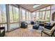 Inviting screened porch with comfortable outdoor seating, a ceiling fan, and a view of the backyard at 1200 Izod Ct, Lawrenceville, GA 30044