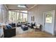Inviting screened porch with comfortable outdoor seating, a ceiling fan, and a view of the backyard at 1200 Izod Ct, Lawrenceville, GA 30044