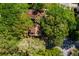Overhead view of a tree-covered property with a glimpse of rooftops, showcasing the surrounding lush greenery at 1326 Metropolitan Se Ave, Atlanta, GA 30316