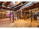 Large unfinished basement with concrete flooring, exposed ceiling, wooden beams and support columns at 1326 Metropolitan Se Ave, Atlanta, GA 30316