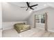 Neutral carpeted bedroom featuring large window with drapes and ceiling fan at 1326 Metropolitan Se Ave, Atlanta, GA 30316