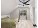 Bedroom features an oversized ceiling fan and vaulted ceilings, with an abundance of natural light at 1326 Metropolitan Se Ave, Atlanta, GA 30316