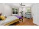 Cozy bedroom features hardwood floors, natural light, and a ceiling fan for added comfort at 1326 Metropolitan Se Ave, Atlanta, GA 30316