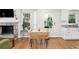 Bright dining area featuring hardwood floors, stone fireplace, and natural light at 1326 Metropolitan Se Ave, Atlanta, GA 30316