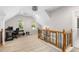 Hallway features a unique wooden railing, desk, and an abundance of natural light at 1326 Metropolitan Se Ave, Atlanta, GA 30316