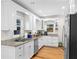 Well-lit kitchen featuring white cabinets, stainless steel appliances, and granite countertops at 1326 Metropolitan Se Ave, Atlanta, GA 30316