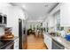 Modern kitchen featuring stainless steel appliances, granite countertops and hardwood floors at 1326 Metropolitan Se Ave, Atlanta, GA 30316