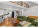 Open-concept living room with a kitchen view, hardwood floors, and a comfortable seating area at 1326 Metropolitan Se Ave, Atlanta, GA 30316