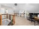 Open loft space with a workspace, railing, and neutral carpet at 1326 Metropolitan Se Ave, Atlanta, GA 30316