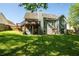 Expansive backyard featuring a well-maintained lawn and a two-level deck at 1570 Hill Crossing Ct, Grayson, GA 30017