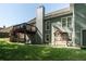 Backyard view highlighting the house, deck, patio, and green lawn at 1570 Hill Crossing Ct, Grayson, GA 30017