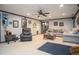 Carpeted basement with a ceiling fan, cozy furniture, and decorative wall art for a warm atmosphere at 1570 Hill Crossing Ct, Grayson, GA 30017