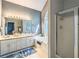 Bright bathroom featuring double vanity, soaking tub, and separate shower at 1570 Hill Crossing Ct, Grayson, GA 30017