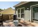 Outdoor deck with a grill, seating area, and backyard views, perfect for entertaining at 1570 Hill Crossing Ct, Grayson, GA 30017