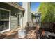 Inviting deck area with outdoor seating and a view of the surrounding trees at 1570 Hill Crossing Ct, Grayson, GA 30017