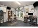 Bright dog grooming space equipped with grooming table, desk, wall art, and ample natural light at 1570 Hill Crossing Ct, Grayson, GA 30017