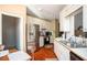 Bright kitchen featuring stainless steel appliances, white cabinets, and a view to the backyard at 1570 Hill Crossing Ct, Grayson, GA 30017