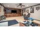 Living room with comfortable seating and a large built-in entertainment center at 1570 Hill Crossing Ct, Grayson, GA 30017