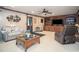 Spacious carpeted living room with built-in shelving and comfortable seating at 1570 Hill Crossing Ct, Grayson, GA 30017