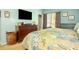 Bedroom with a large bed, carpet flooring, natural light, and a view of the ensuite bathroom at 1570 Hill Crossing Ct, Grayson, GA 30017