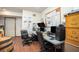 Home office space with dual monitors, a wooden barrel accent, and a well-lit workspace at 1570 Hill Crossing Ct, Grayson, GA 30017