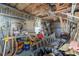 Workshop with a variety of tools, including a miter saw and ladders, suitable for home projects at 1570 Hill Crossing Ct, Grayson, GA 30017
