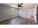 Bright bedroom with natural light, wood-look floors, closet, and gray walls with white trim at 2077 Perkerson Rd, Atlanta, GA 30310