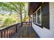 Side deck features dark railings and black-trimmed windows at 2077 Perkerson Rd, Atlanta, GA 30310