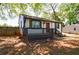 Charming home with black railing and a dark red front door at 2077 Perkerson Rd, Atlanta, GA 30310