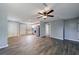 Open-concept living area with an updated kitchen featuring white cabinetry and stainless appliances at 2077 Perkerson Rd, Atlanta, GA 30310