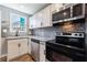 Updated kitchen features stainless steel appliances, granite countertops, and modern backsplash at 2077 Perkerson Rd, Atlanta, GA 30310