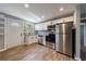 Modern kitchen features stainless appliances, white cabinets, and granite countertops at 2077 Perkerson Rd, Atlanta, GA 30310