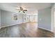 Spacious living room with sleek wood-look flooring, neutral paint, and ample natural light at 2077 Perkerson Rd, Atlanta, GA 30310