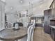 Eat-in kitchen with farmhouse dining table and dark cabinets at 815 Commerce Trl, Canton, GA 30114