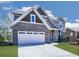 Attractive home showcasing a brick facade, a spacious two-car garage, and well-maintained landscaping at 815 Commerce Trl, Canton, GA 30114