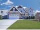 Lovely two-story home with a brick-accented garage, charming porch, and a beautifully landscaped front yard at 815 Commerce Trl, Canton, GA 30114