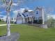 Beautiful two-story home showcasing a brick-accented garage, cozy front porch, and landscaped front yard at 815 Commerce Trl, Canton, GA 30114