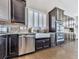 Well appointed kitchen has stainless appliances, tile backsplash, and granite counters at 815 Commerce Trl, Canton, GA 30114