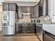 Spacious kitchen with stainless steel appliances and plenty of dark wood cabinets at 815 Commerce Trl, Canton, GA 30114