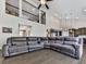 Spacious living room with gray, oversized sectional couch and views to second story at 815 Commerce Trl, Canton, GA 30114