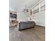 Open-concept living room features a stone fireplace, ceiling fan, and hardwood floors at 815 Commerce Trl, Canton, GA 30114
