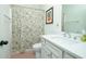 Cozy bathroom features a tub, shower, and vanity with a sink and nice fixtures at 90 Cerro St, Atlanta, GA 30314