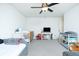 Neutral colored Bedroom with two cribs, a ceiling fan, a side chair and grey carpet at 90 Cerro St, Atlanta, GA 30314