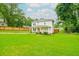 Two-story home boasting a spacious green lawn and a covered porch at 90 Cerro St, Atlanta, GA 30314