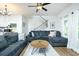 Cozy living room features hardwood floors, ceiling fan, and comfortable sectional sofa at 90 Cerro St, Atlanta, GA 30314