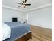 A king sized bed is situated in the spacious main bedroom with a tray ceiling and ceiling fan at 90 Cerro St, Atlanta, GA 30314